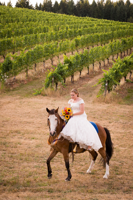 Bride riding a horse on her wedding day at Sarver Winery, Oregon