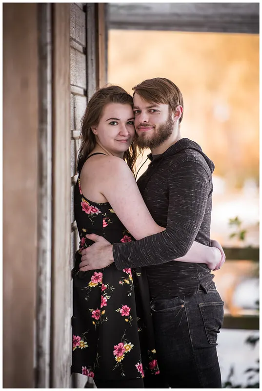 Engagment photo session of a couple taken in trees and snow at Dorris Ranch in Oregon