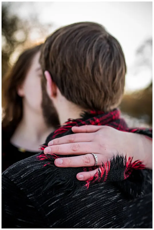 Engagment photo session of a couple taken in trees and snow at Dorris Ranch in Oregon