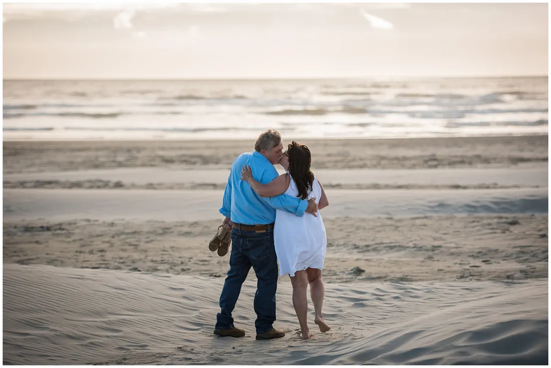 A couple embracing on the Oregon coast