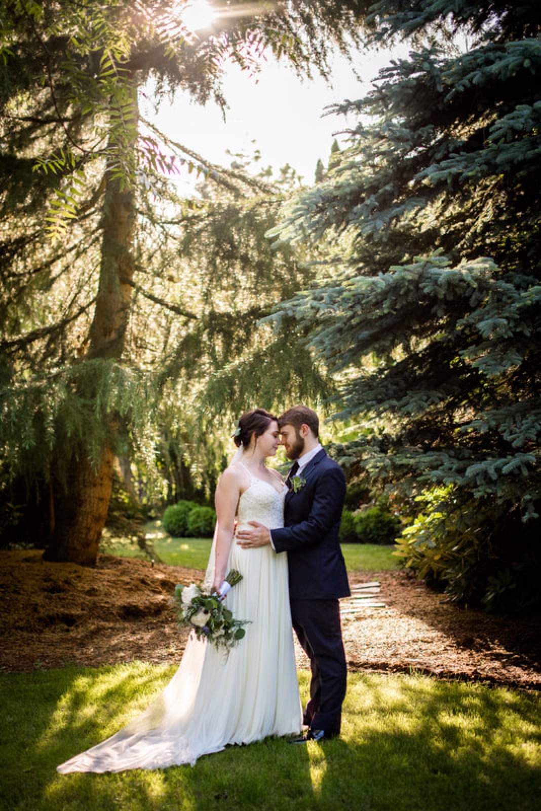 Newlyweds together in an Oregon forest