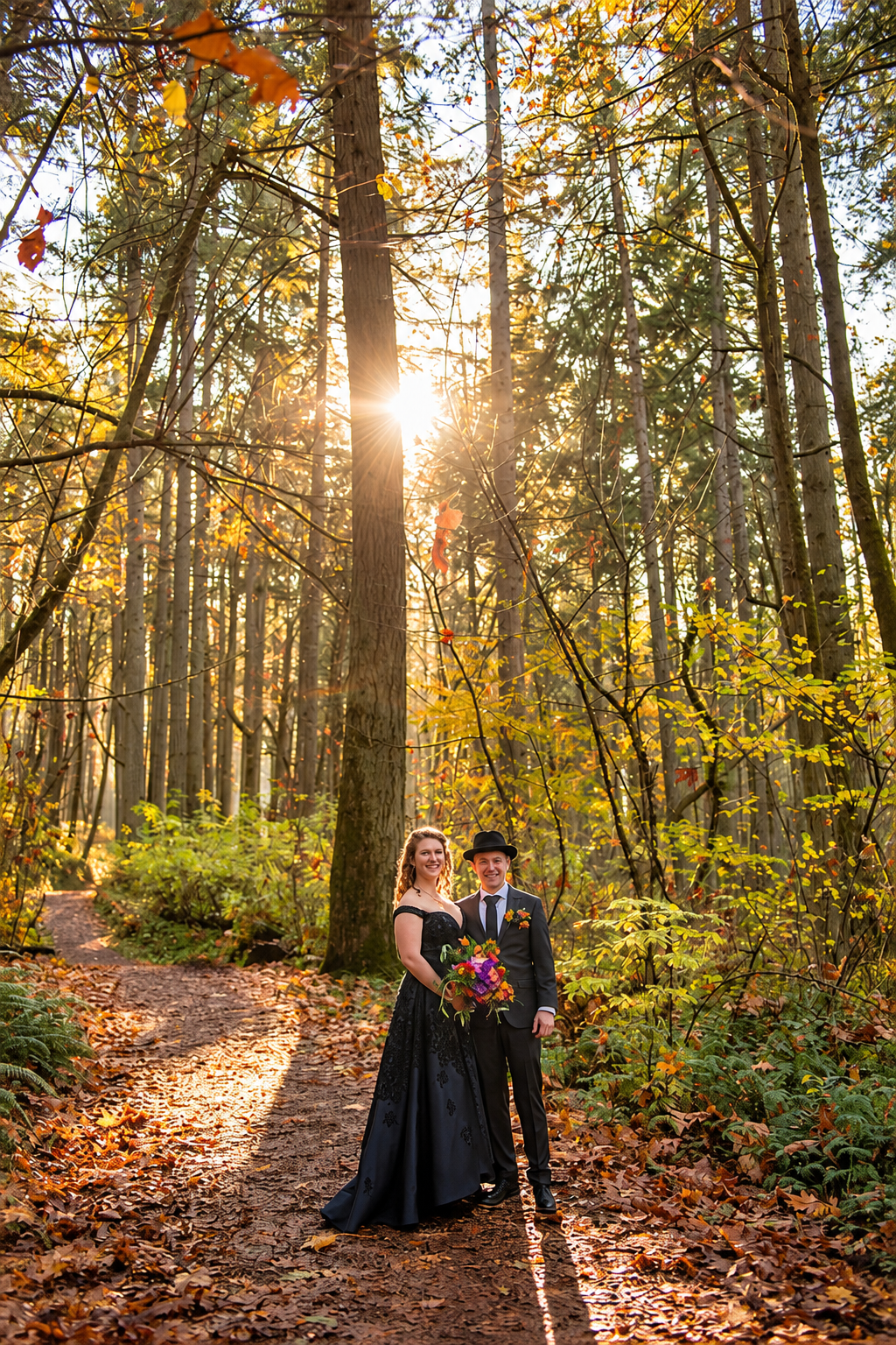 A wedding couple beneath the trees at Hendrick’s Park