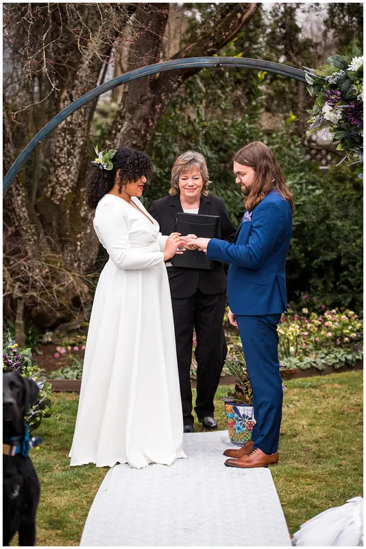 A couple exchanging vows at their backyard wedding in Eugene