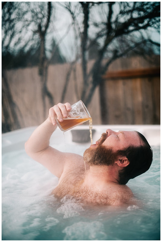 Hot tub dudeoir sexy photo shoot with bearded man.Picture