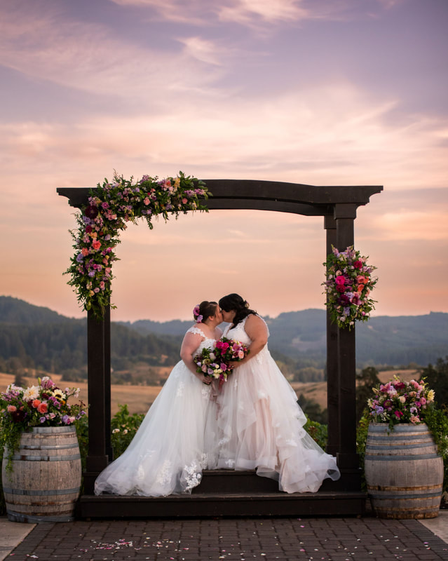Wedding photography of two brides getting married at Sweet Cheeks Winery.