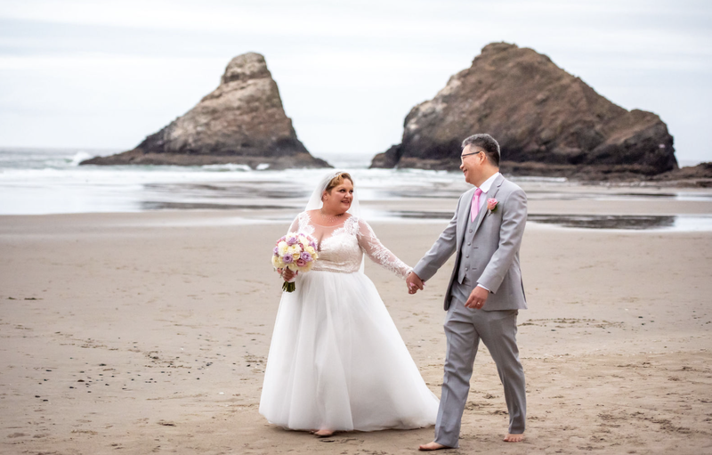 Wedding couple at Heceta Beach in Oregon.  Oregon beach wedding photography.