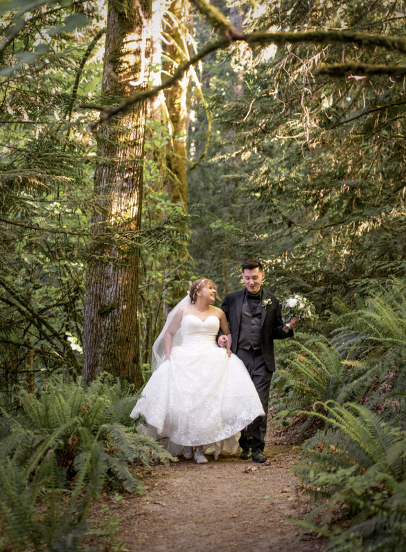 Wedding couple walking in the Oregon forest on a wilderness trail.  Oregon wedding and elopement photogrpher.
